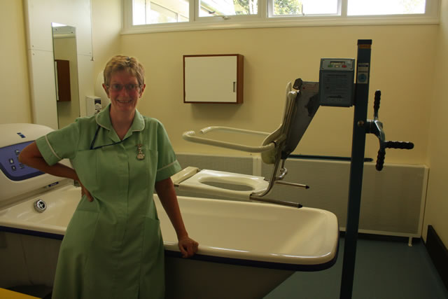 HCA Valerie Burns assists patients at bath time