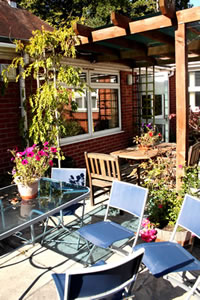 Outside patio area, perfect for relaxing on a sunny day