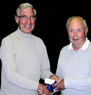 Tony Cole (left) handing the scroll of Life Vice Chairman to Jim Eastaugh