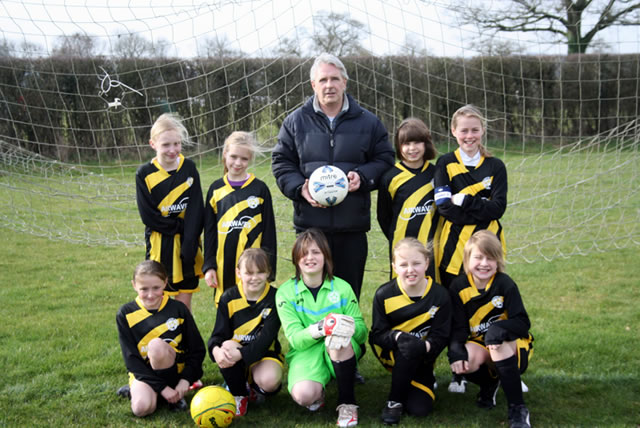 Wincanton Youth FC under 11 girls team with their new kit, accompanied by sponsor Mr Gary Bridger