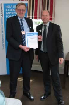 Steve Beech being presented his certificate by Mr. Steve Ford, Chief Executive Officer, Parkinson's UK