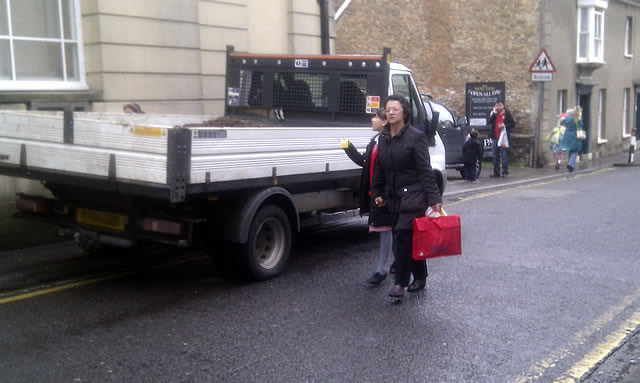 There's a cash machine behind the truck.