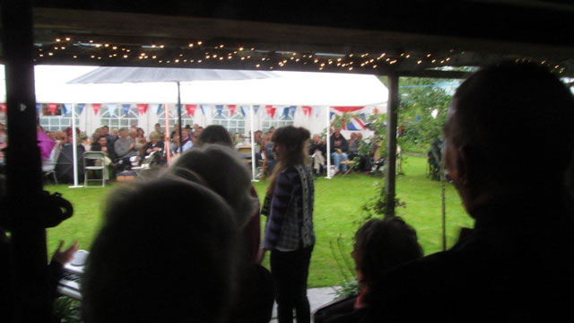 Choir singing from the Summer house