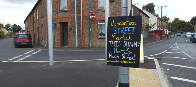 Wincanton Street Market chalk sign, on the roundabout at the bottom of South Street