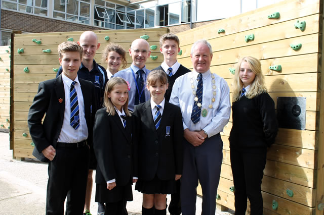 King Arthur's School staff and students standing with Wincanton Mayor, Cllr Deryck Lemon, by the new climbing equipment