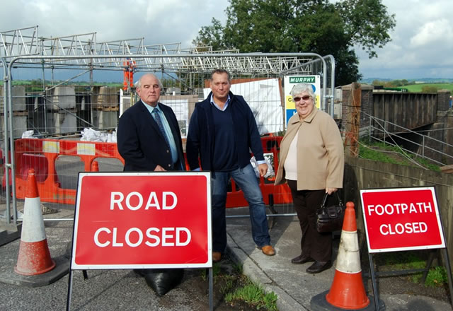 David Warburton, Mike Lewis and Janette Cronie standing in front of the Castle Cary bridge works