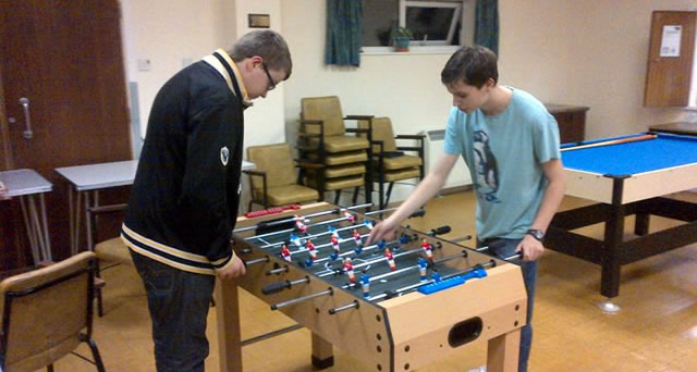 Teenagers playing table football at Wincanton Youth Club