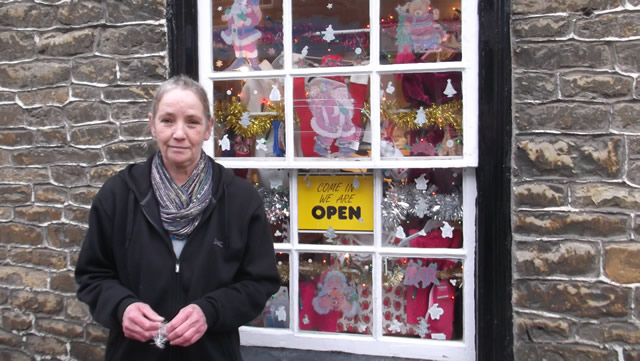 Margaret Whelan, standing in front of her shop window on Wincanton High Street