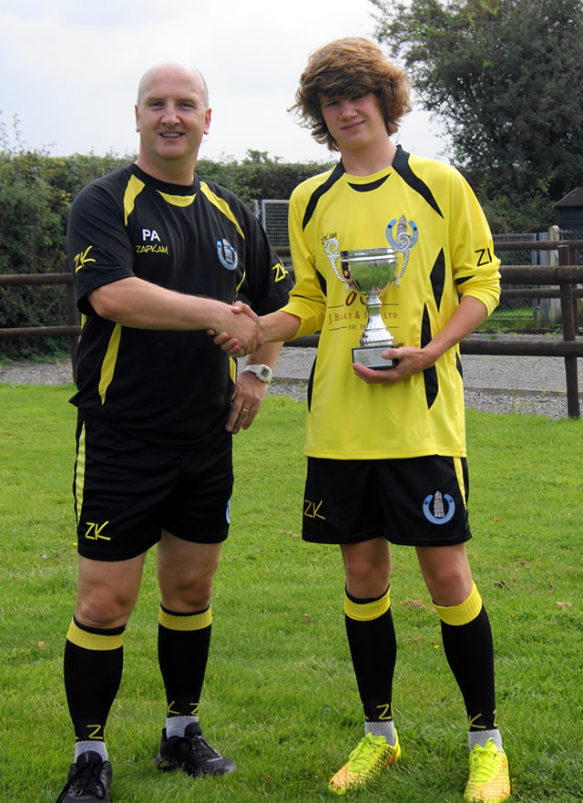 Harry Warwick being presented the Manager's Player Award by under 14s coach Phil Appleby