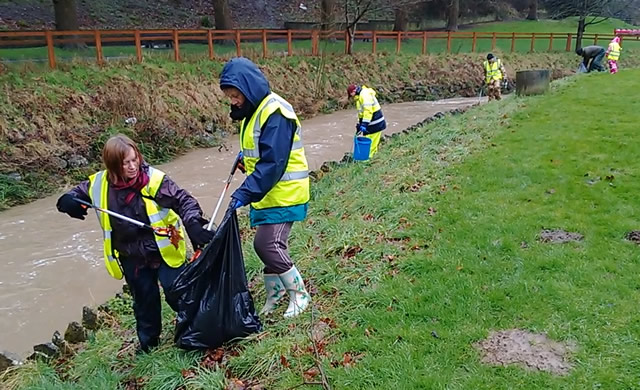 Volunteers picking litter on the banks of the River Cale, Wincanton