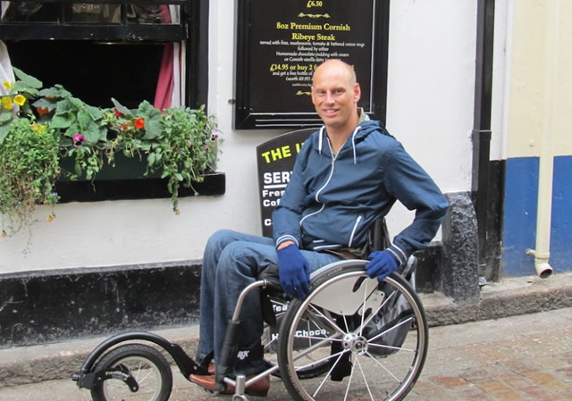 Andy Hall with his wheelchair specially adapted to cope with the cobbles and slopes of streets in the south west.