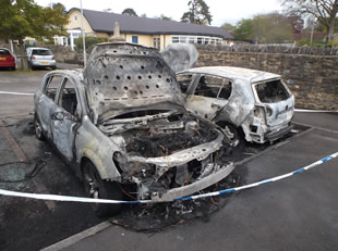 Burnt cars in Wincanton Memorial Hall car park, from a different angle