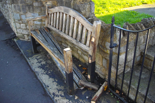 Damaged memorial bench