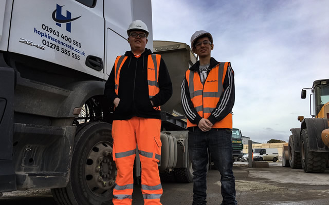 Matthew and Christian standing next to a Hopkins Concrete lorry