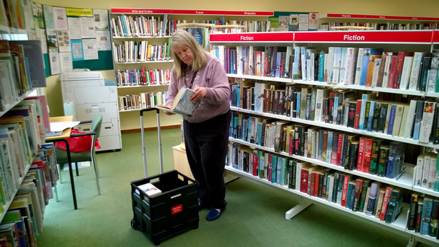 Pam Golding choosing books from Wincanton Library for her Home Library Service subscribers