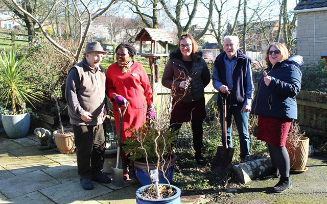 Carrington House staff and residents out in the garden