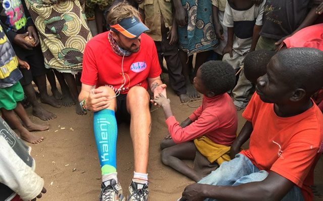 Brendan Rendall with children in Malawi