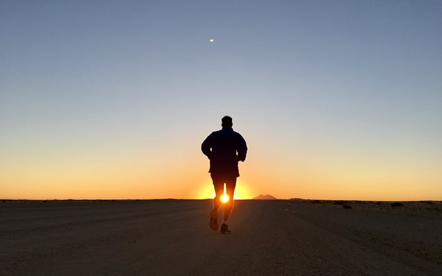 Brendan Rendall running into the sunset