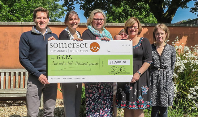 Simon Whitehead from Myakka & Kirsty Campbell from SCF present the £2,500 cheque to Sammie Peckover, Angela England (just visible), Liz Morley & Sian Reddick from GAPS