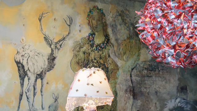 Murals and the aluminium can lamp shade at the Greening the Earth gallery in Wincanton
