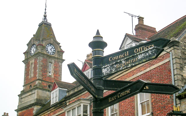Wincanton Market Place signpost, with the clock tower in the background