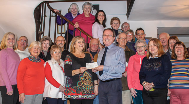The Pilgrim Singers present a cheque for £1000 to the CAT Bus