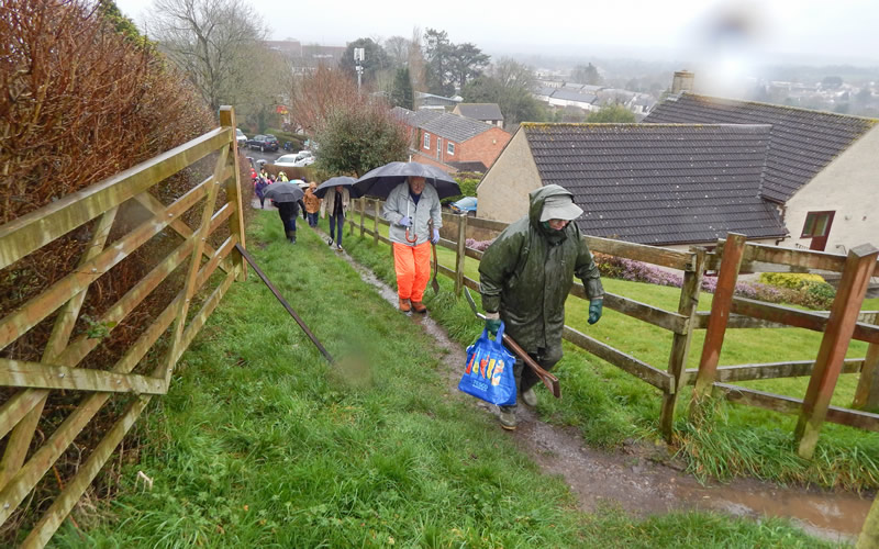 Ascending the steep path to Wrixon's View to participate in the tree-planting