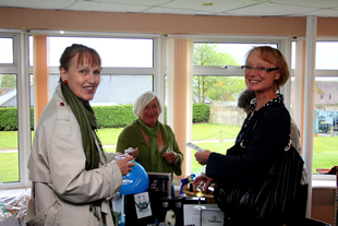 Chistine Feaver and Libby Smith buy their raffle tickets