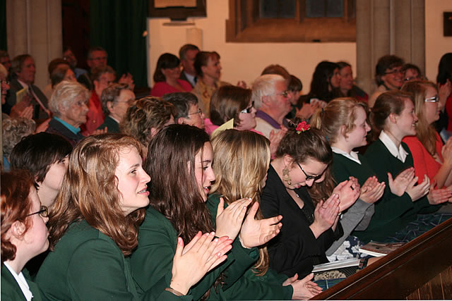 Applause from congregation, parents and students