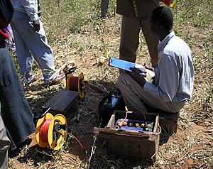 Sema undertaking a water survey of Ughandi 'B' and its five sub villages