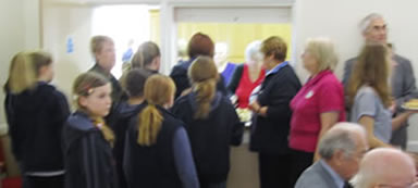 The guides line up to serve the guests