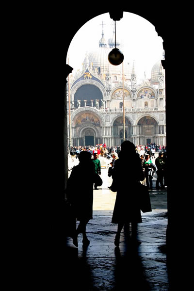 View of a square through an arch