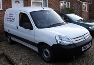 You can't quite see, but there's a hair-cutting sign on the side of this van.