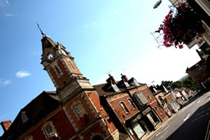 An arty, angular shot of the clock tower, with a view down Church Street