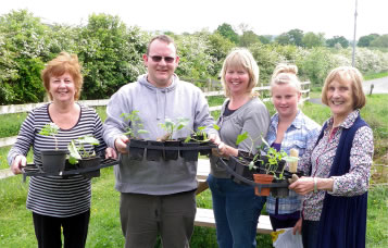 Crop growers with their produce