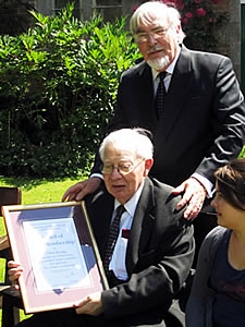 Frank Foster and Chris Kemp hold his framed certificate of Life Membership