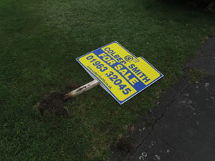 A broken Colbert Smith "For Sale" sign