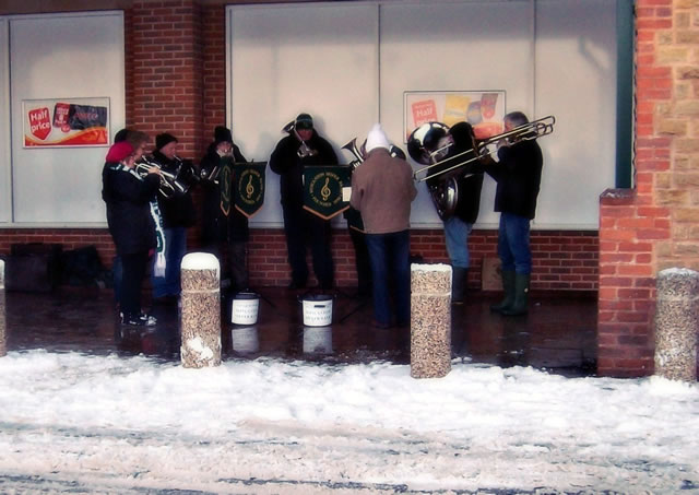 We Wish You a Merry Christmas! Wincanton Town Band Plays in the Snow, by Hannah Pink