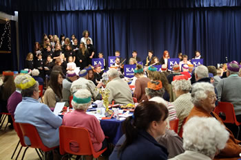 School orchestra and choir entertaining the guests