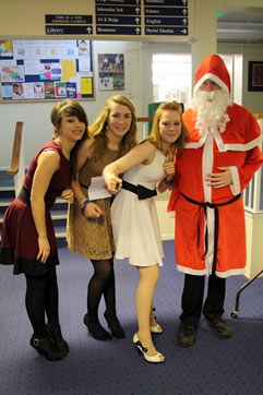 A warm welcome by students and Santa