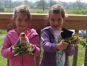 Twins with Easter bird's nests