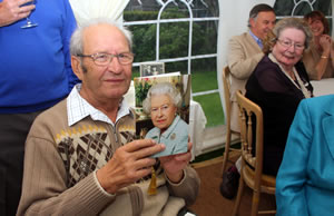 Jeff holding a card from the Queen