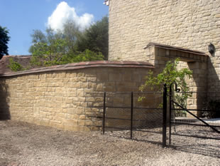 Dry stone gateway and wall