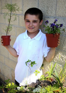 Boy with plants, to state the obvious.