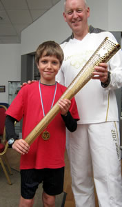 Edward Young gets an opportunity to hold the real Olympic torch