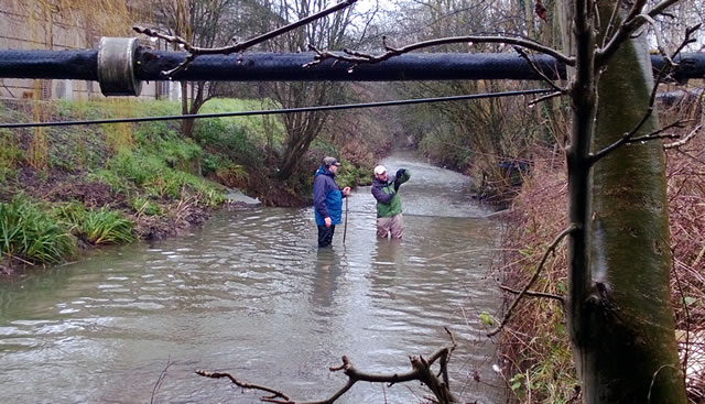 Behind Matt and Mike you can see the drop of the weir