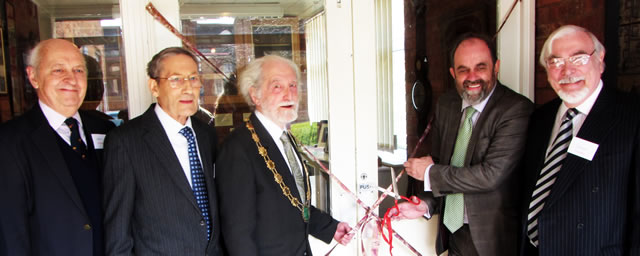 David Heath MP cutting that ribbon, this time from a slightly different angle.