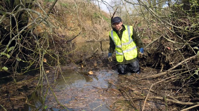 Gary Hunt inspecting the River Cale blockage, before it was cleared by CATCH