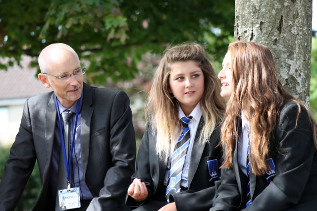 Headteacher Mr Beech with two King Arthur's students