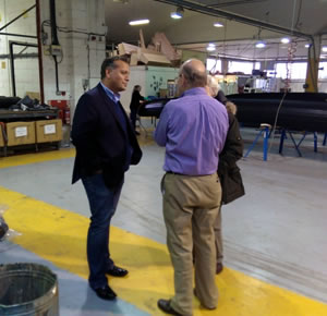 David Warburton talking to Chris Hornidge, MD of Henshaw Inflatables, with District Cllr Colin Winder.